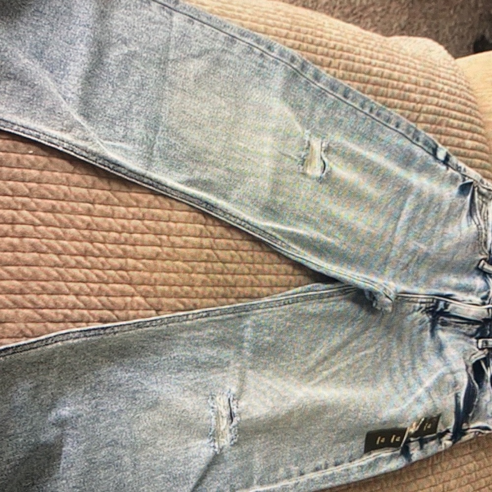 New light blue distressed jeans